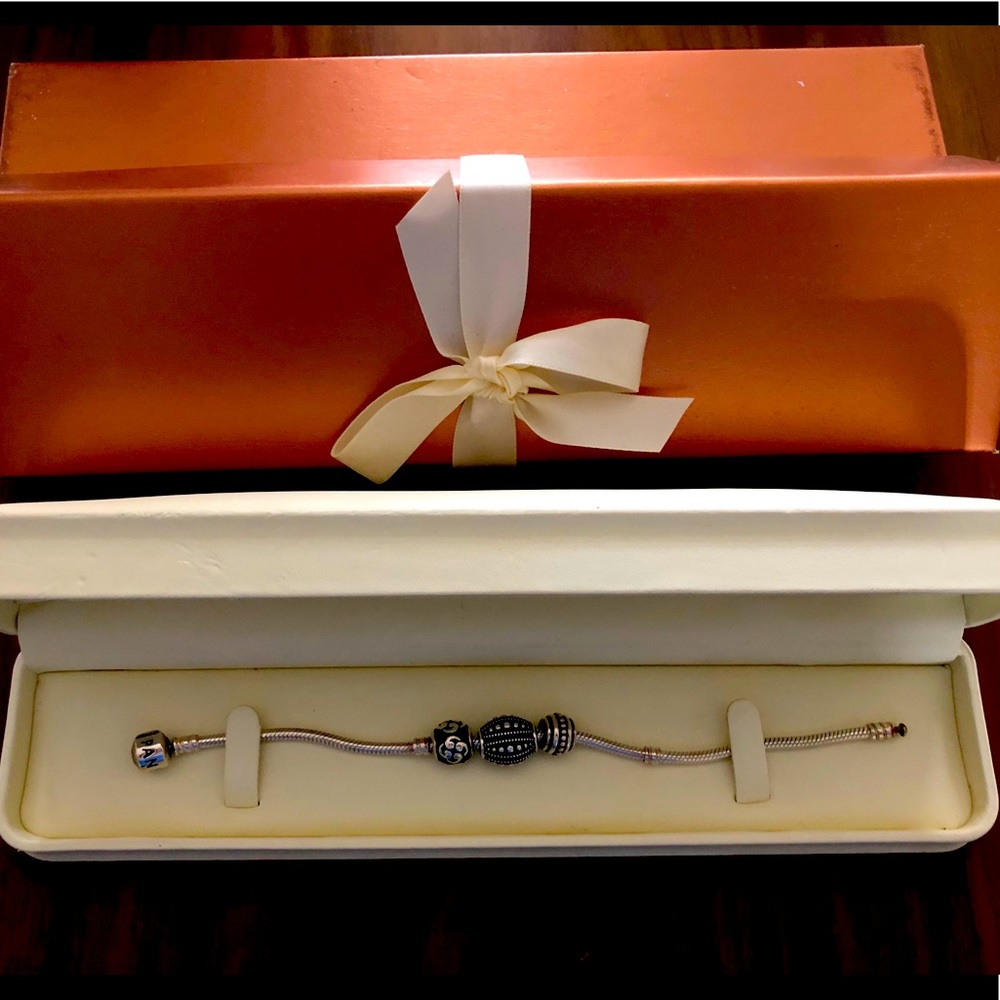 Pandora Bracelet with 3 charms.